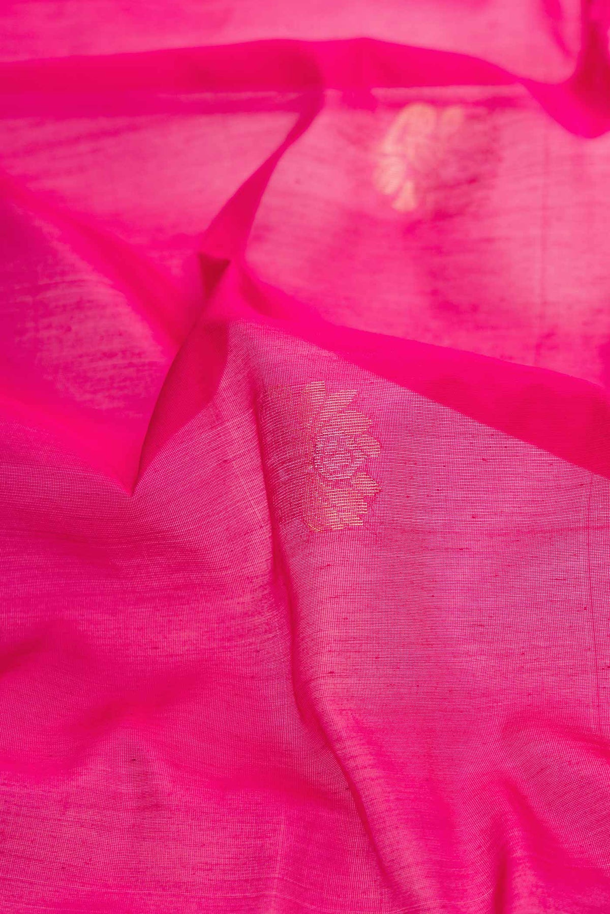Close up of Pink Dual Tone Silk Cotton Saree with Zari Butta on the body and Zari Border displaying folds