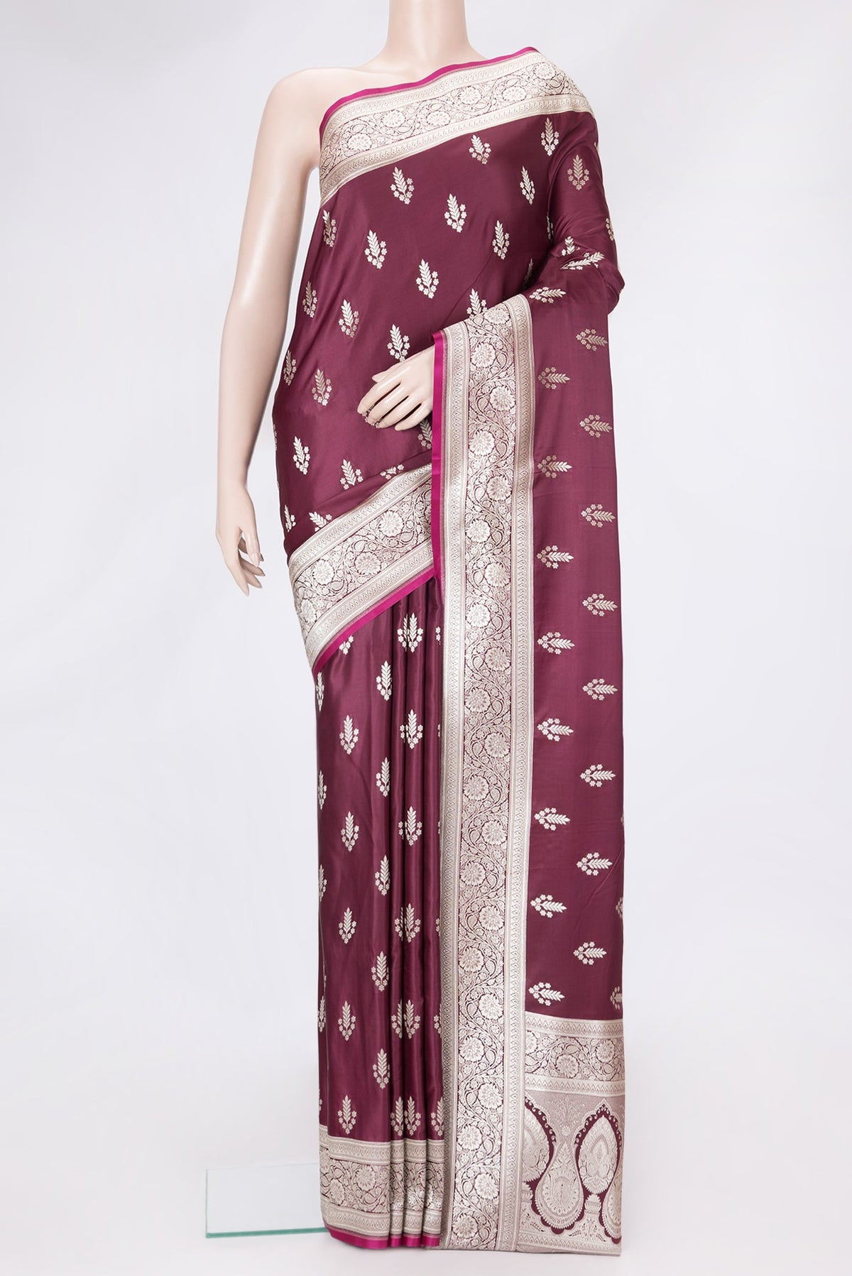 Maroon Dual Tone Banarasi Silk Saree with Zari Butta on the body and Zari Border.  displayed on a mannequin
