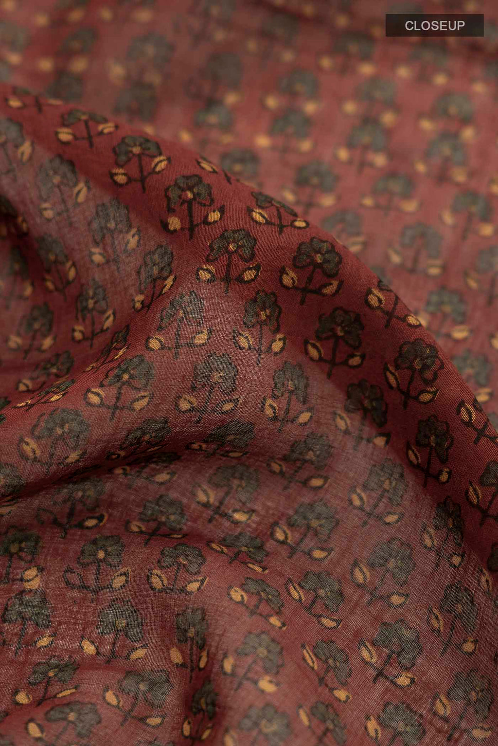 Close up of Rust Chanderi Silk Cotton SareePrinted design on the body and Zari Border displaying folds