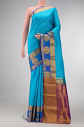 Sky Blue Dual Tone Kanjivaram Silk Saree with Jacquard With Zari Butta on the body and Fancy Border.  displayed on a mannequin