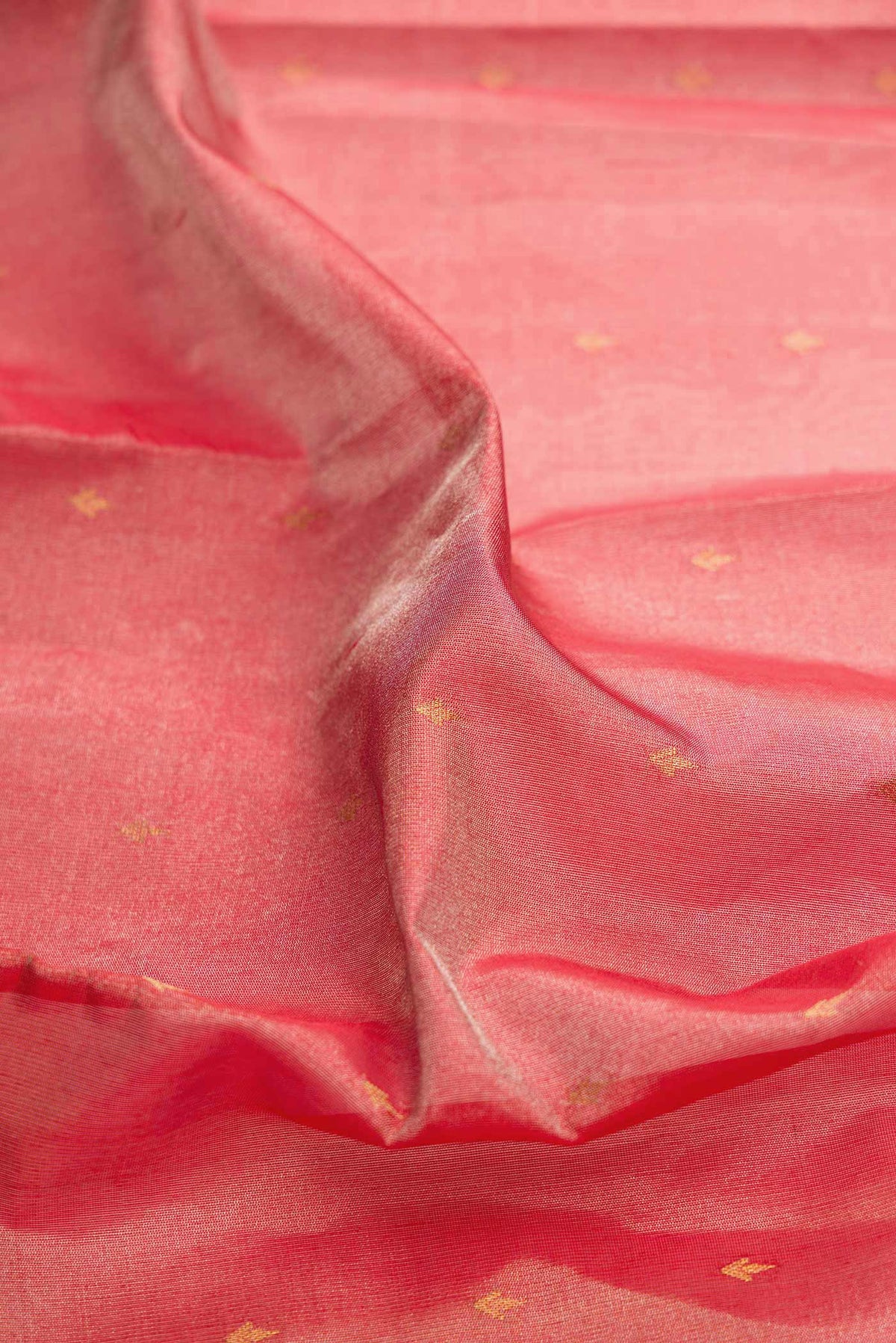 Close up of Red Dual Tone Kanchipuram Tissue Silk Saree with Zari Brocade on the body and Plain Border displaying folds