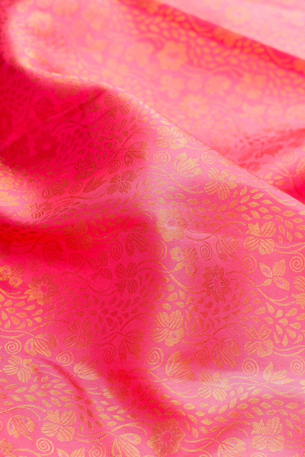 Close up of Pink Dual Tone Kanchipuram Silk Saree with Zari Brocade on the body and Zari Border displaying folds