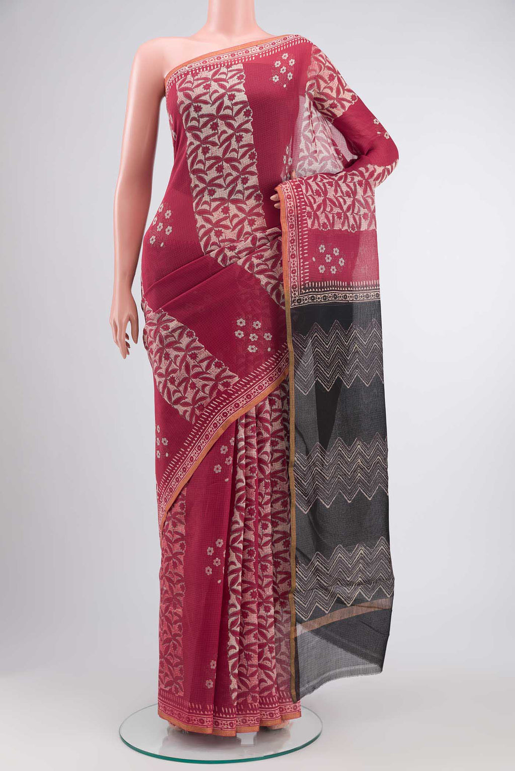 Rust Kota Cotton SareePrinted design on the body and Zari Border displayed on a mannequin