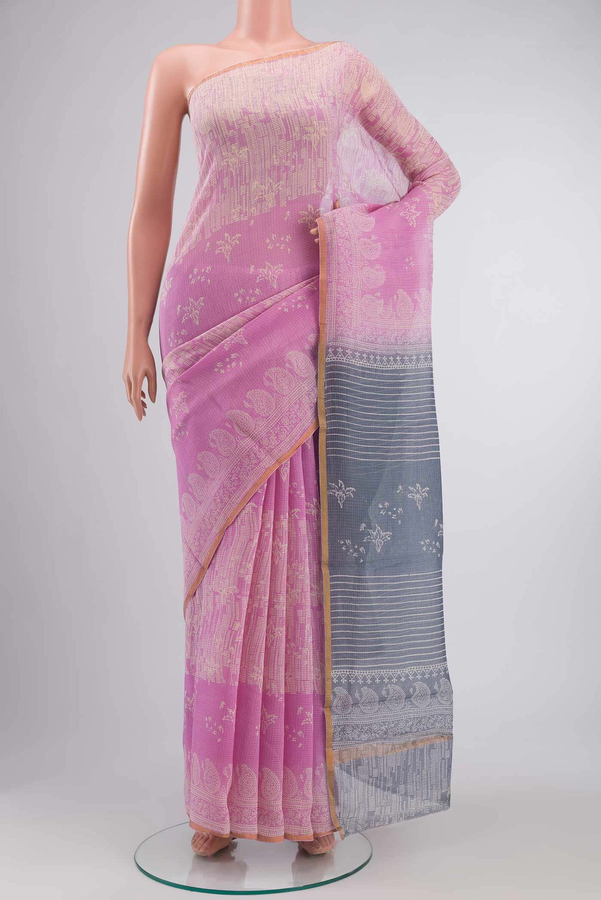 Pink Kota Cotton SareePrinted design on the body and Zari Border displayed on a mannequin