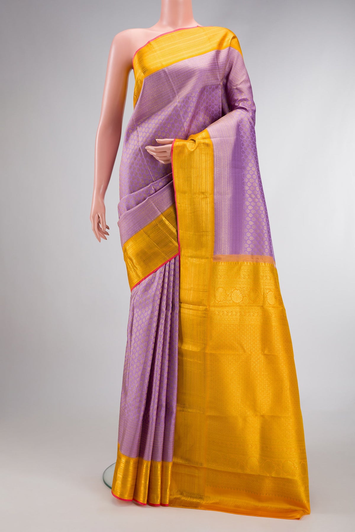 Lavender Dual Tone Kanchipuram Silk Saree with Zari Brocade on the body and Zari Border.  displayed on a mannequin
