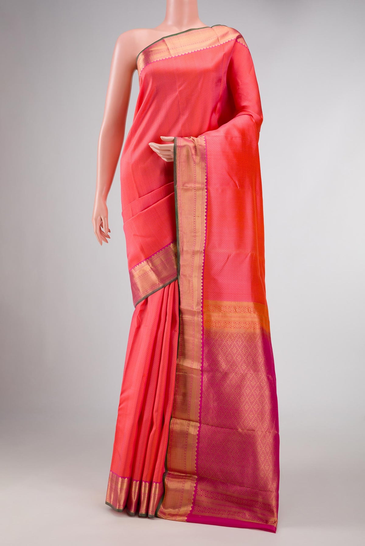 Orange Dual Tone Kanchipuram Silk Saree with Jacquard design on the body and Zari Border displayed on a mannequin