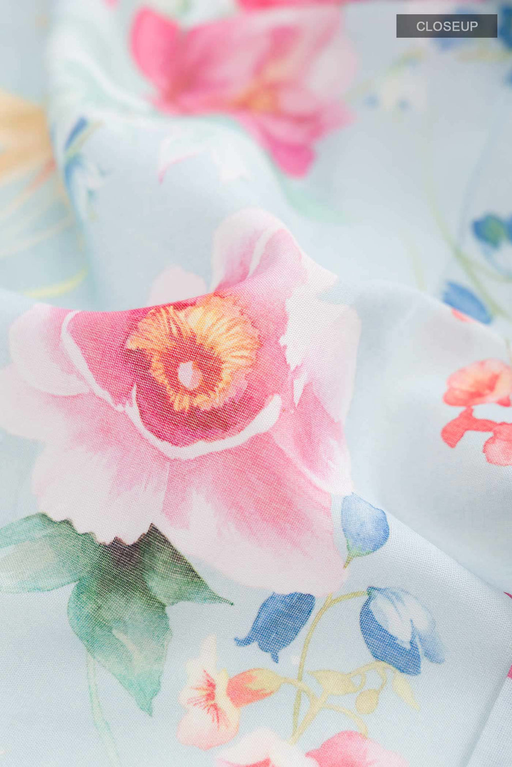 Close up of Blue Paithani Cotton SareePrinted design on the body and Zari Border displaying folds