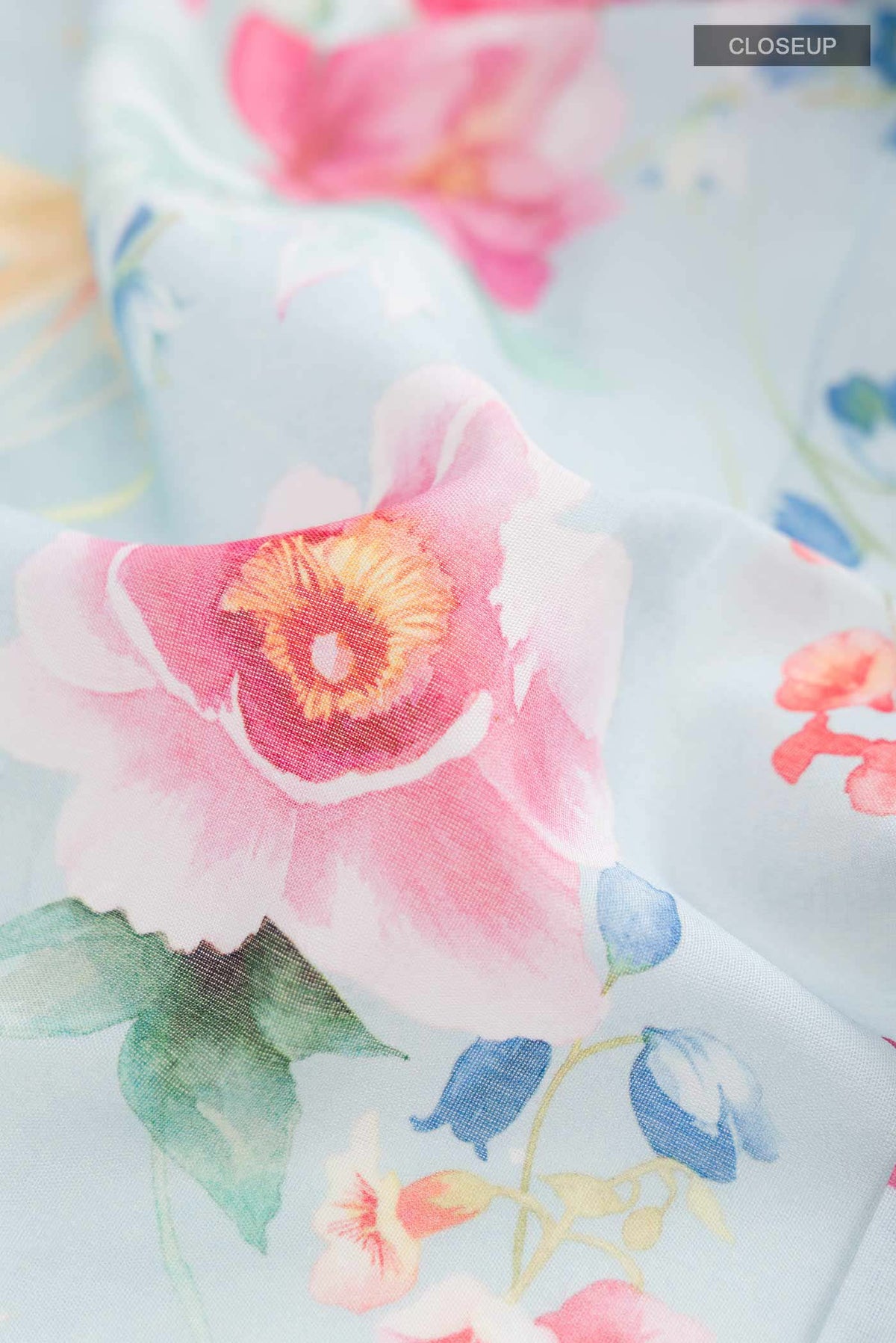 Close up of Blue Paithani Cotton SareePrinted design on the body and Zari Border displaying folds