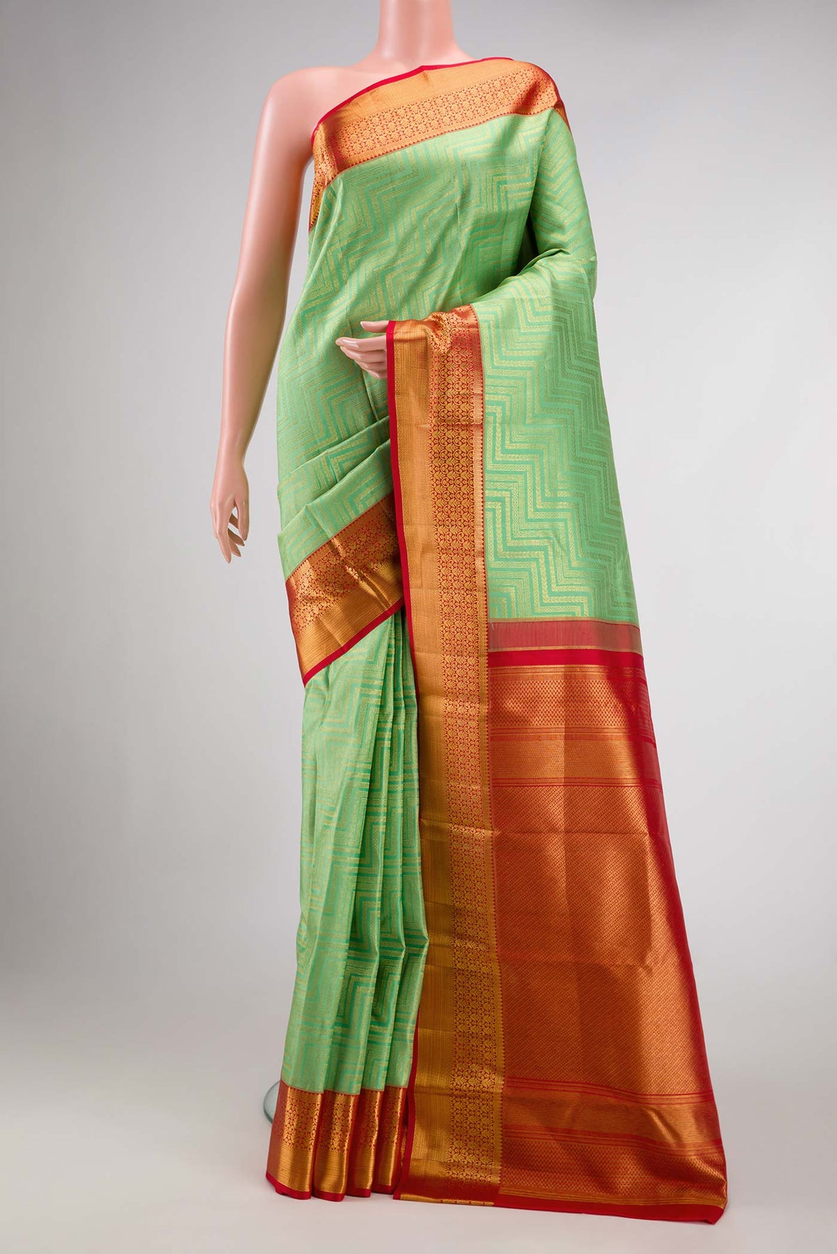 Pista Green Dual Tone Kanchipuram Silk Saree with Zari Brocade on the body and Zari Border.  displayed on a mannequin