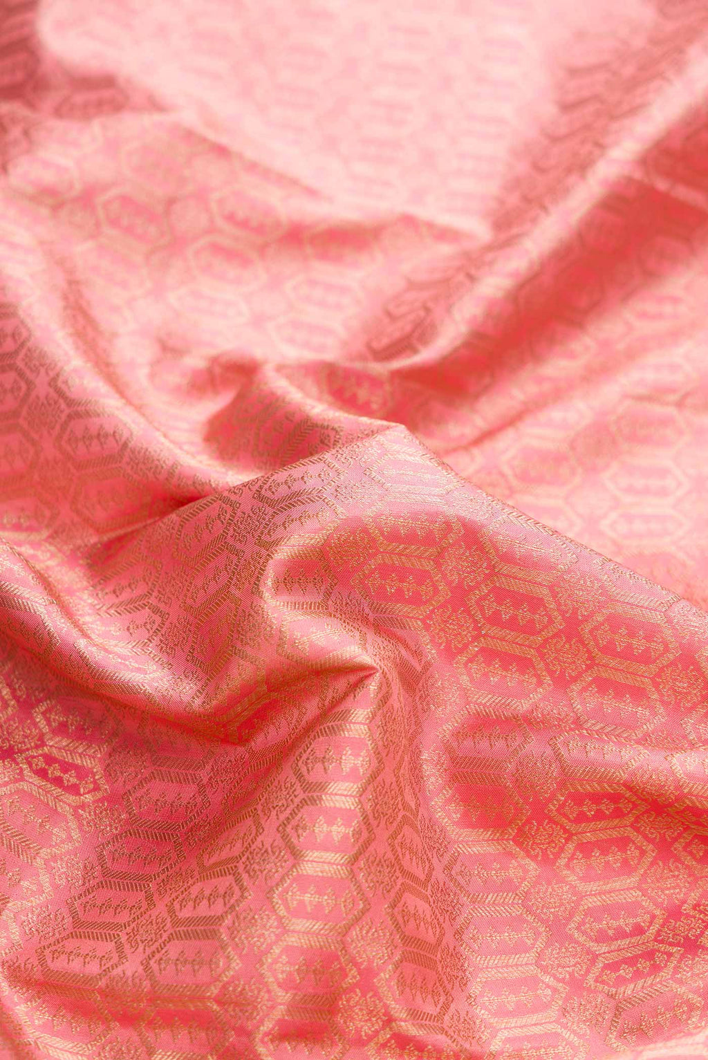 Close up of Pink Dual Tone Kanchipuram Silk Saree with Zari Brocade on the body and Zari Border displaying folds