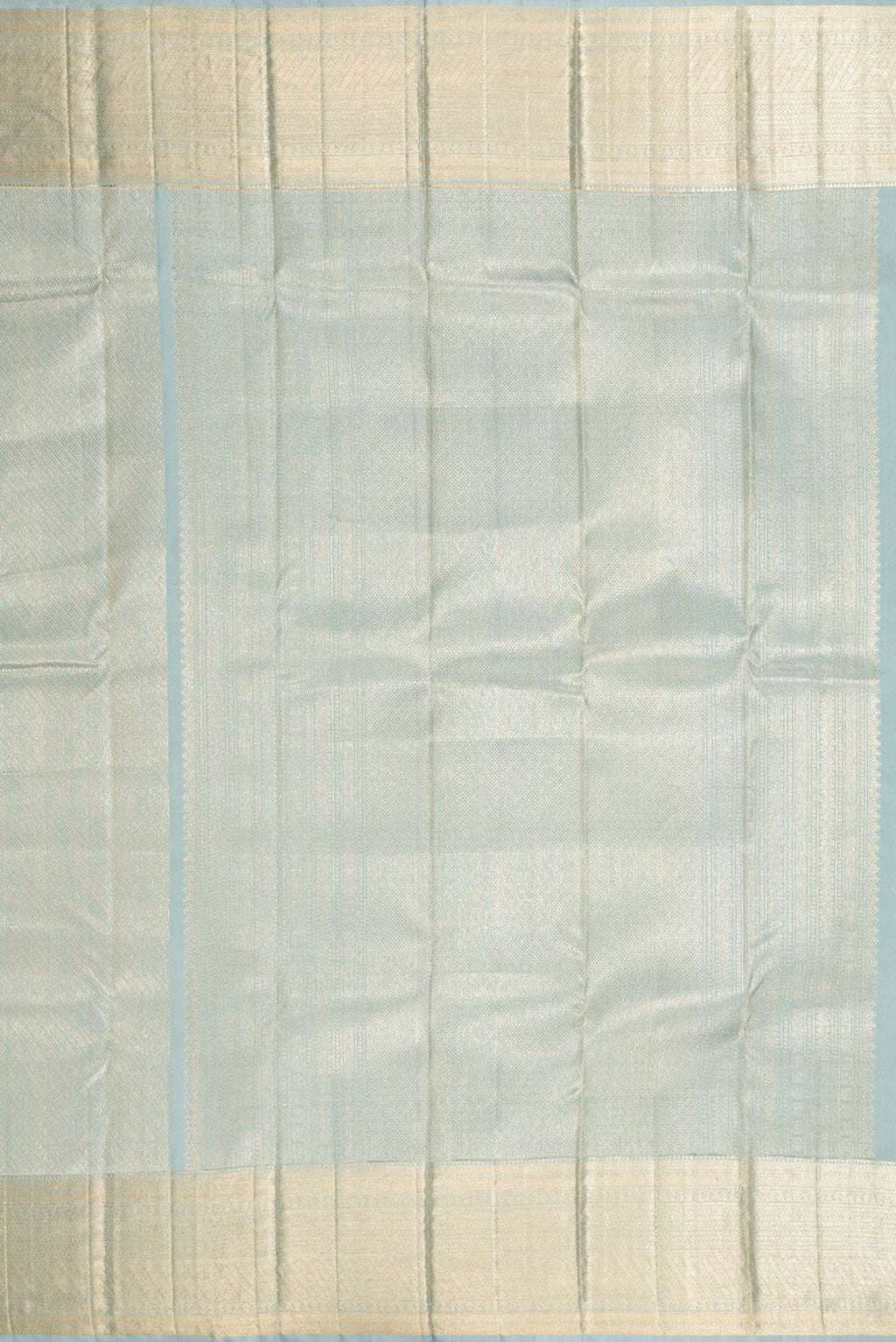 Close up image of the pallu of Grey Dual Tone Kanchipuram Silk Saree with Zari Brocade on the body and Zari Border. 