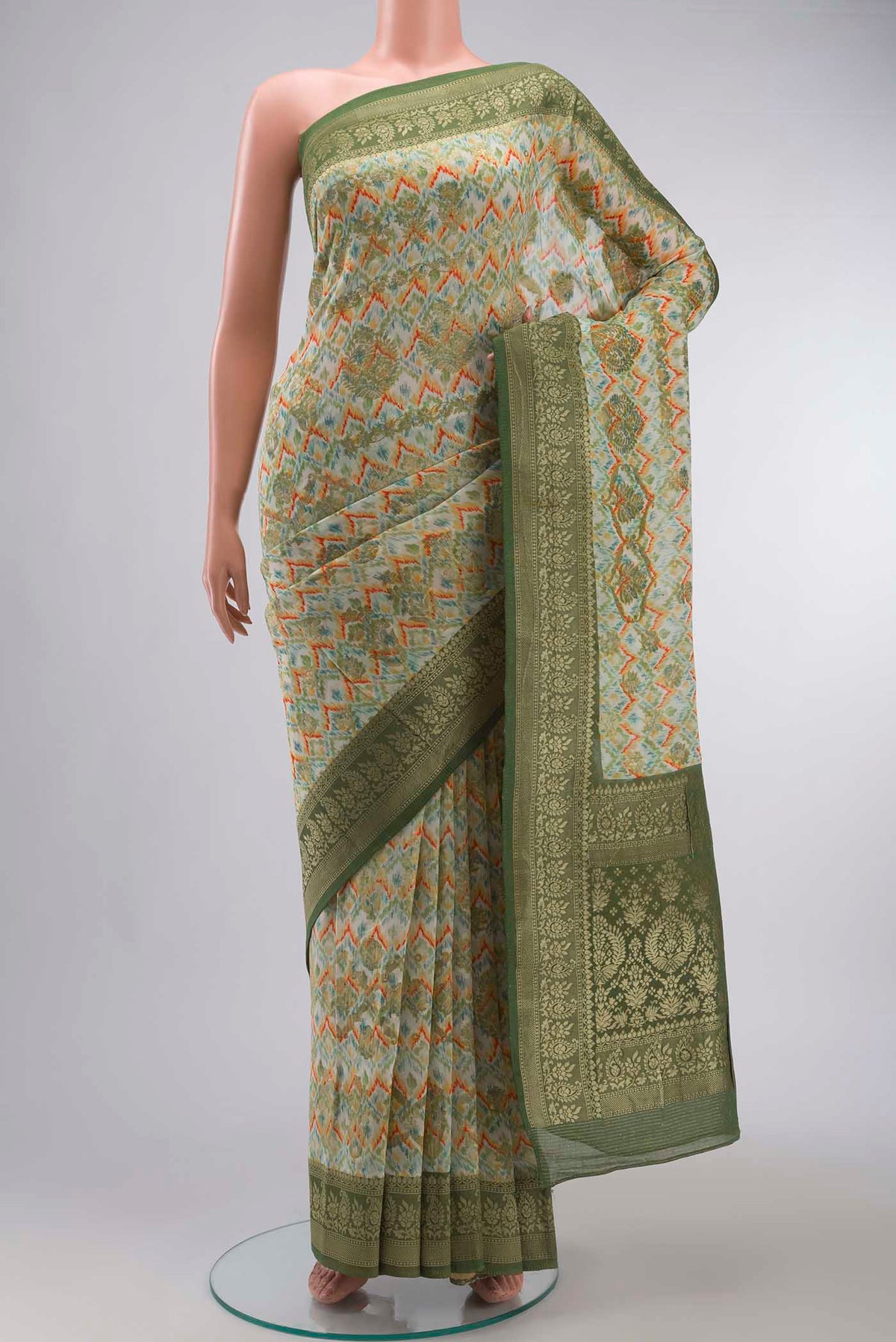 Off White Banarasi Georgette Saree with Printed design on the body and Zari Border displayed on a mannequin