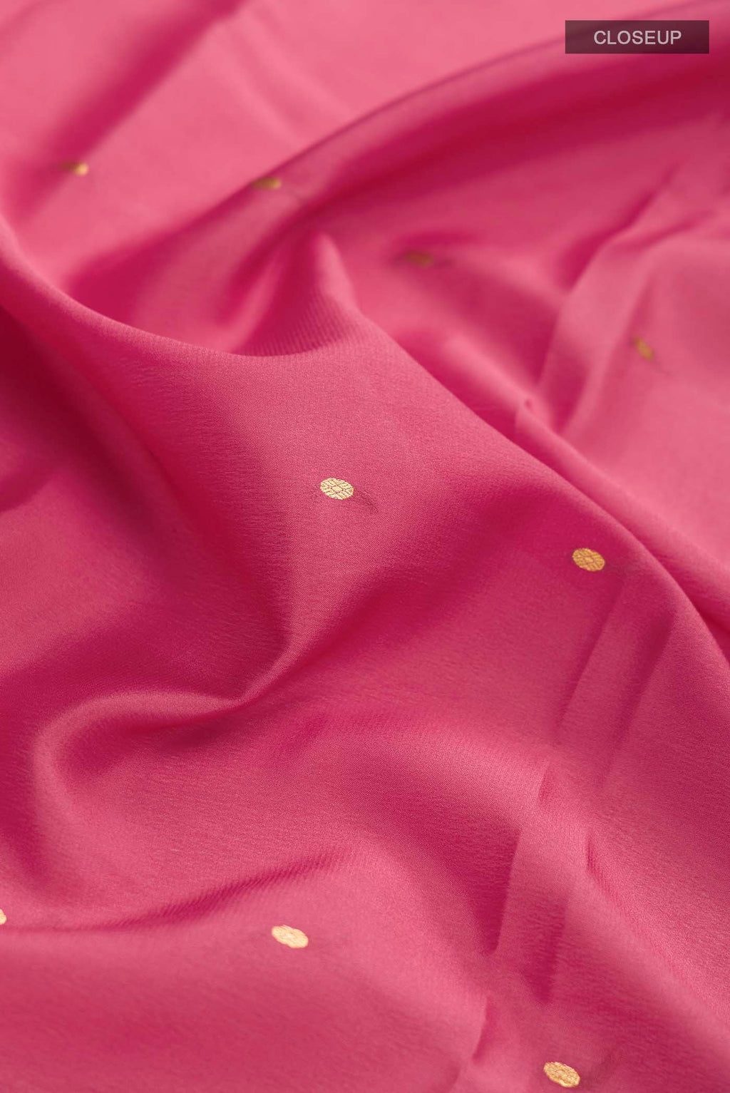 Close up of Pink Mysore Crepe Saree with Zari Butta on the body and Zari Border displaying folds