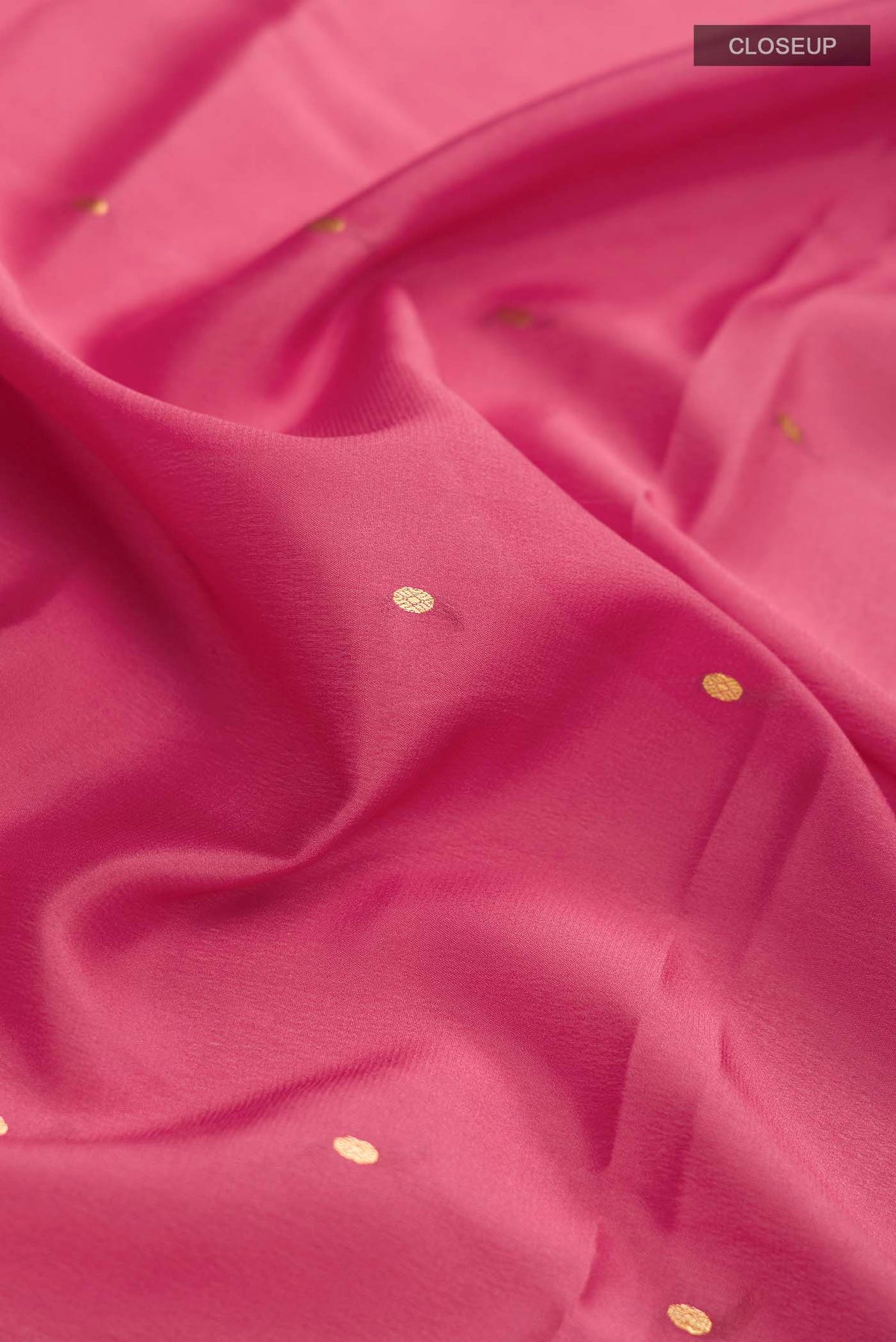 Close up of Pink Mysore Crepe Saree with Zari Butta on the body and Zari Border displaying folds