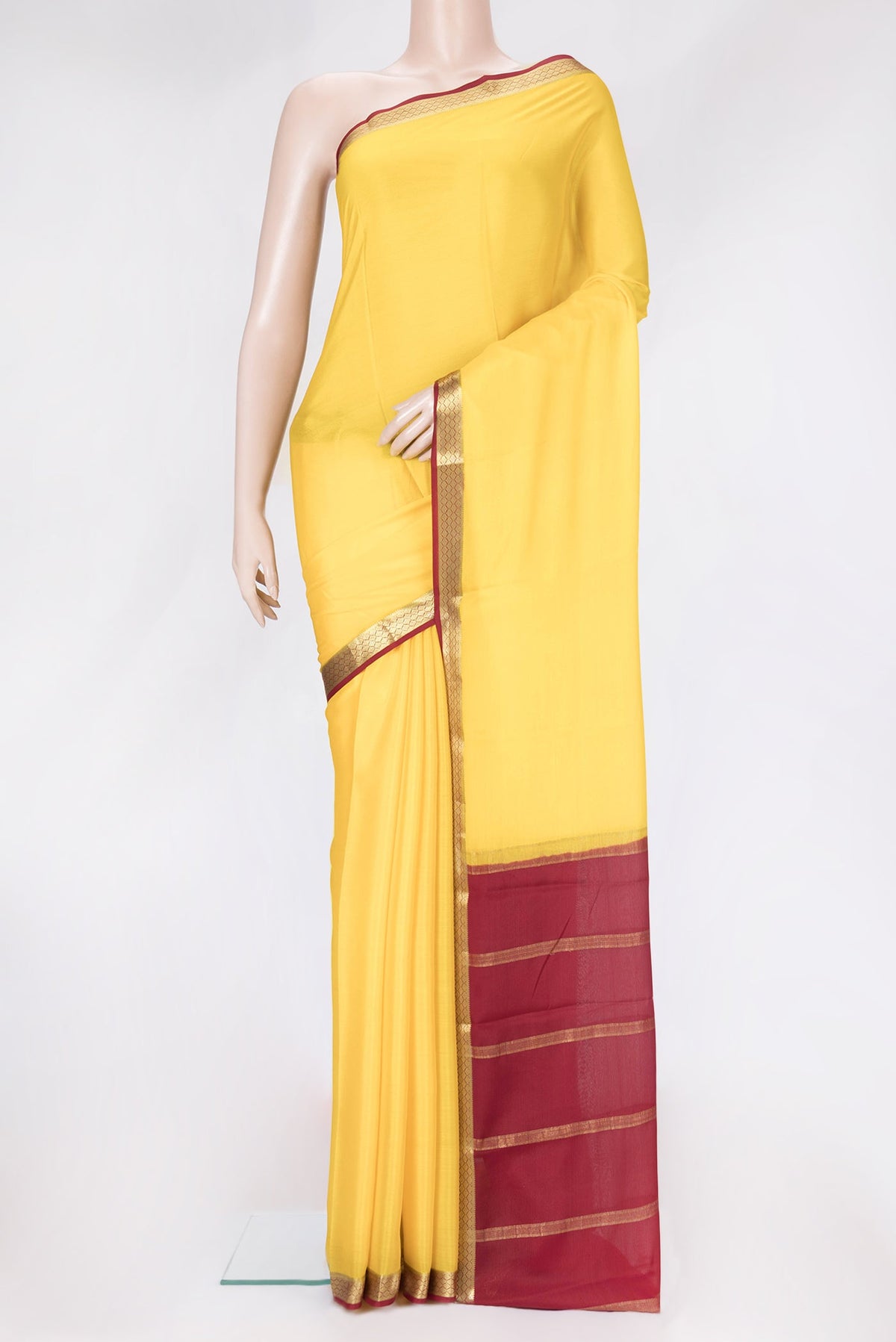 Yellow Dual Tone Mysore Silk Saree with Plain Body and Zari Border.  displayed on a mannequin
