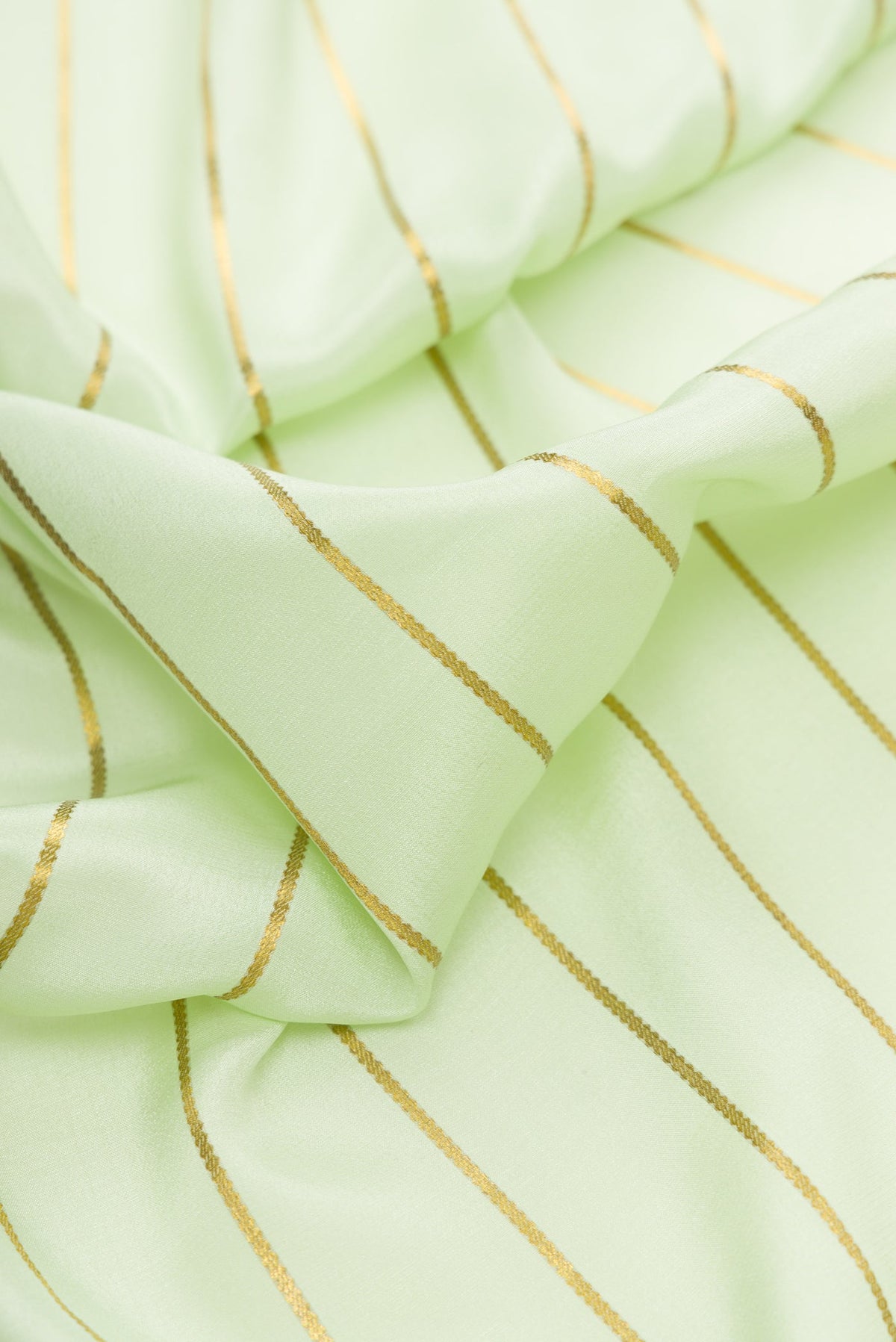 Close up of Pista Green Dual Tone Mysore Silk Saree with Stripes on the body and Fancy Border.  displaying folds