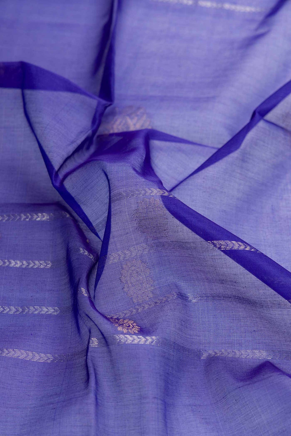 Close up of Royal Blue Dual Tone Silk Cotton Saree with Zari Butta on the body and Zari Border displaying folds