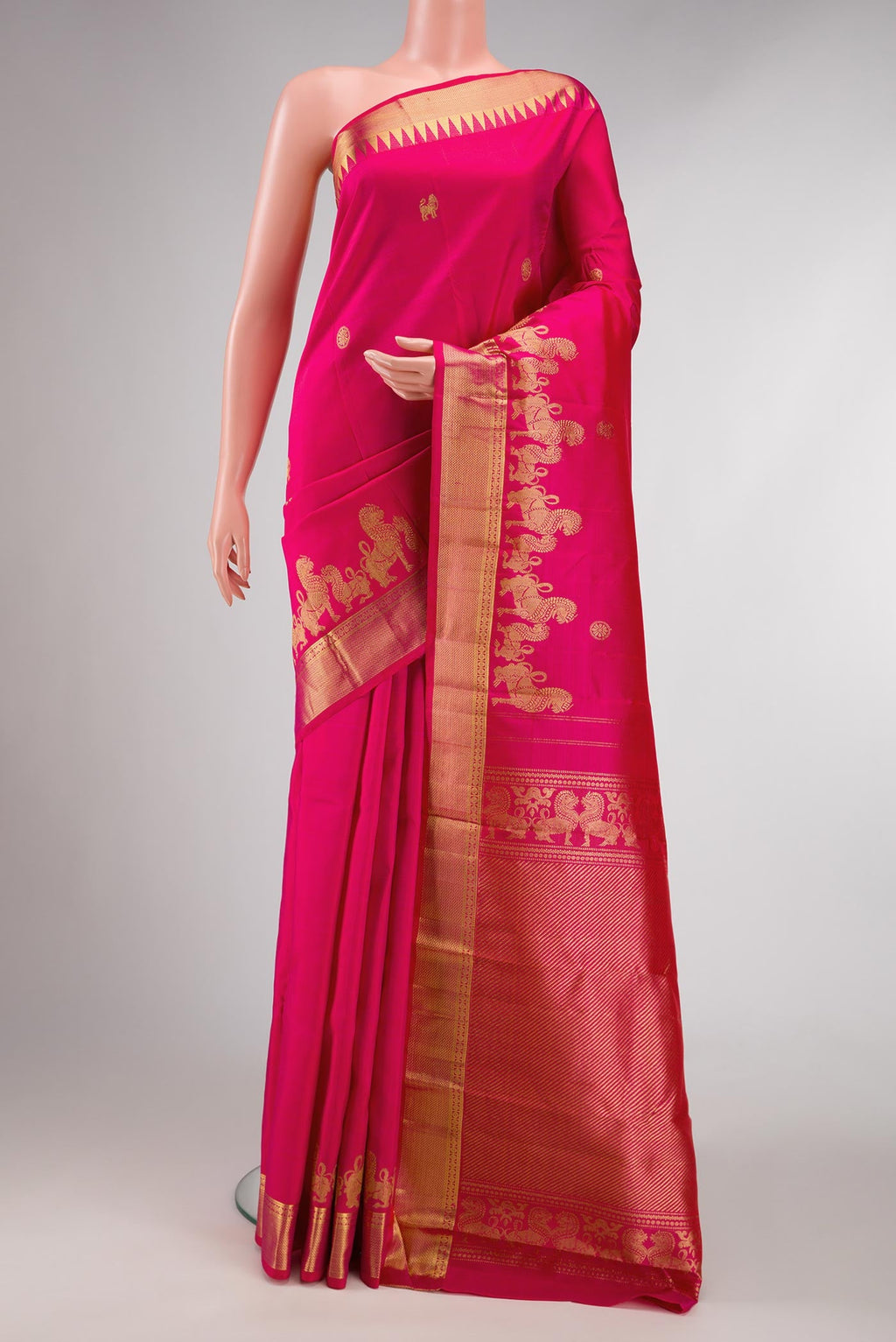 Dark Pink Dual Tone Kanchipuram Silk Saree with Zari Butta on the body and Zari Border displayed on a mannequin