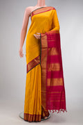 Mustard Dual Tone Kanjivaram Silk Nine Yards Saree with Stripes on the body and Zari Border.  displayed on a mannequin