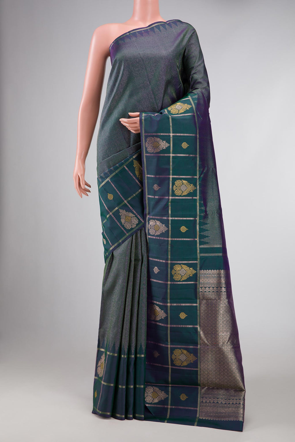 Peacock Blue Dual Tone Kanchipuram Silk Saree with Zari Brocade on the body and Fancy Border displayed on a mannequin