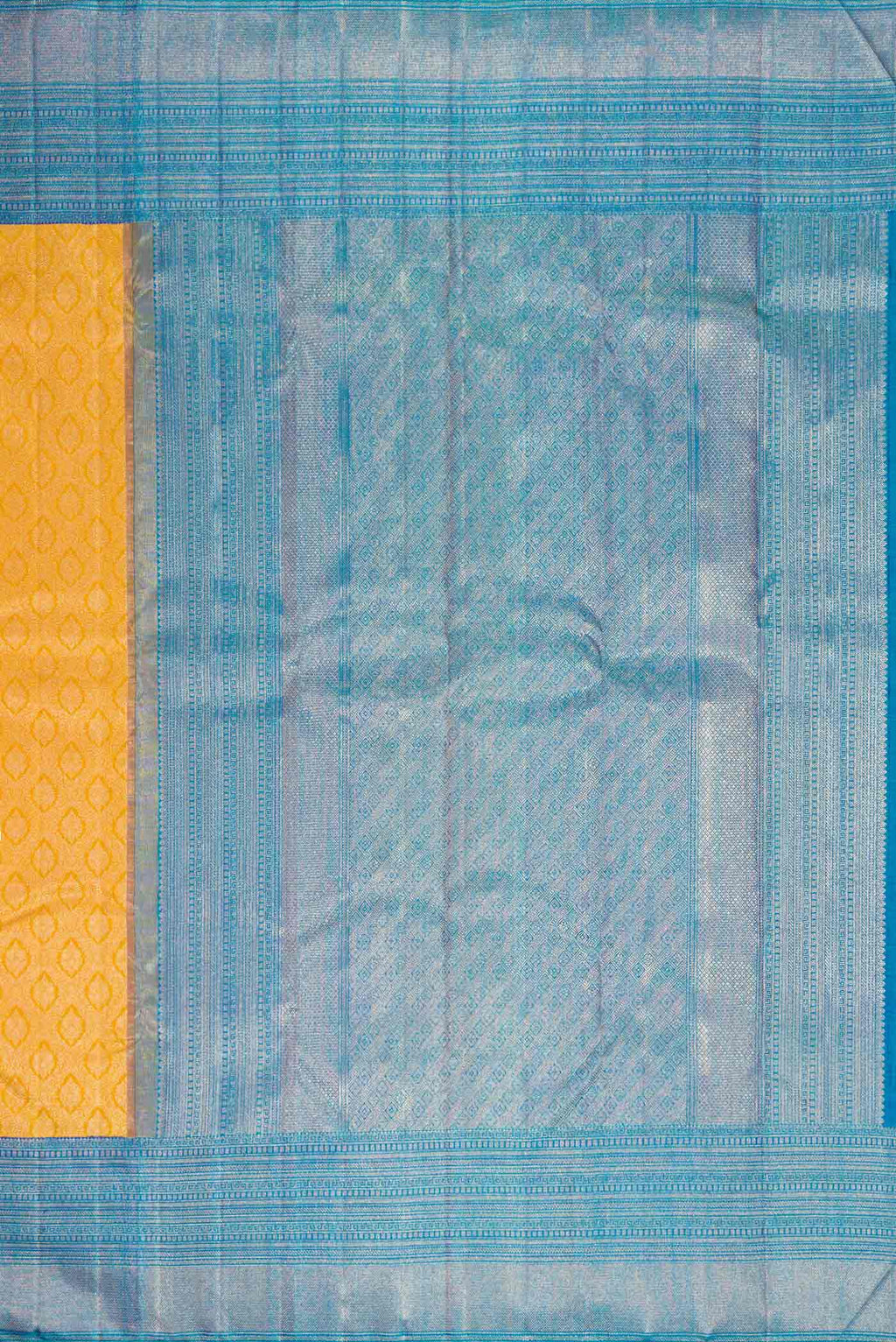 Close up image of the pallu of Yellow Kanchipuram Silk Saree with Zari Brocade on the body and Zari Border