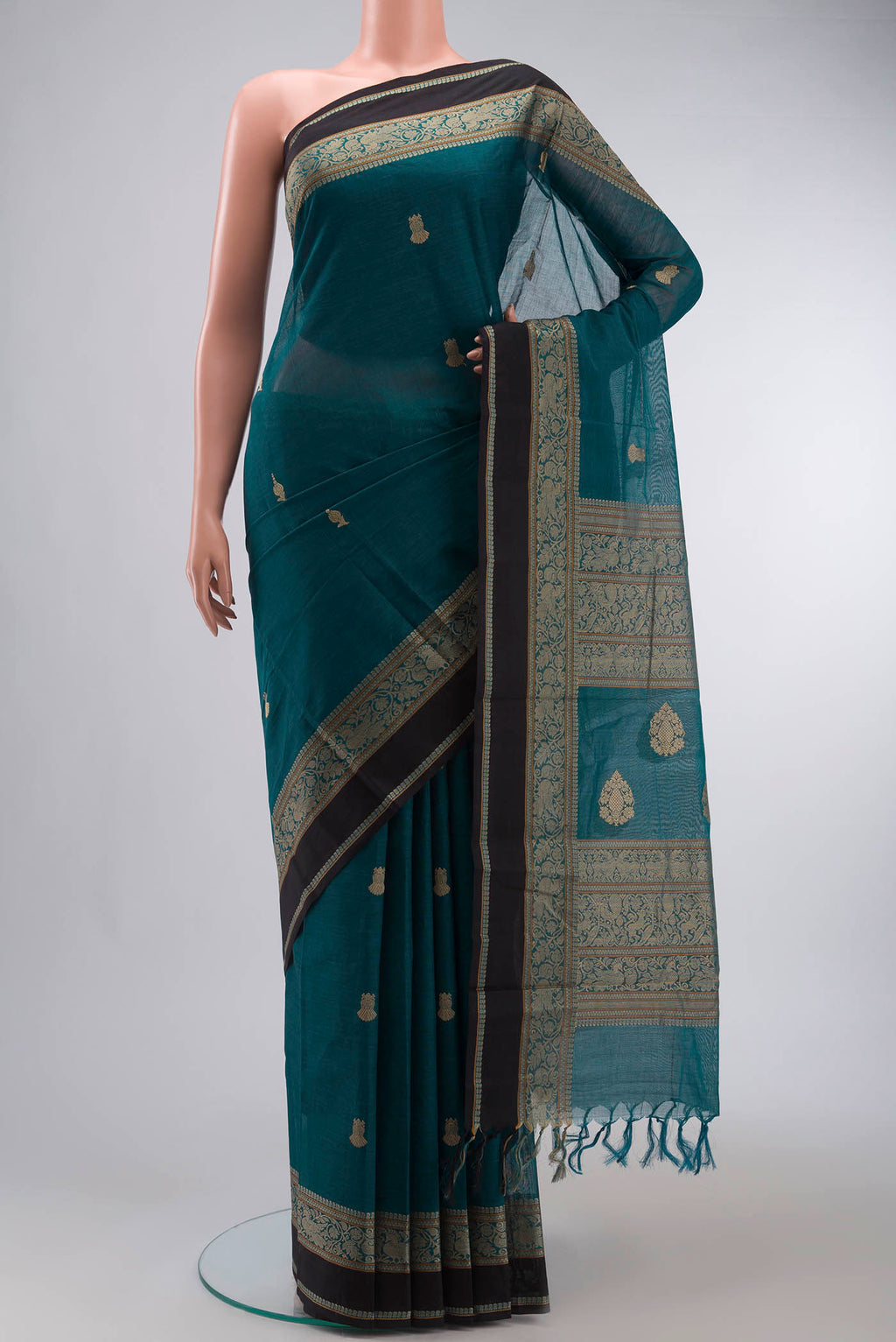 Teal Kanchi Cotton Saree with Plain Body and Thread Border displayed on a mannequin