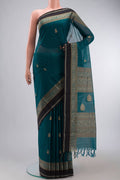 Teal Kanchi Cotton Saree with Plain Body and Thread Border displayed on a mannequin