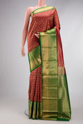 Maroon Kanchipuram Silk Saree with Zari Brocade on the body and Zari Border.  displayed on a mannequin