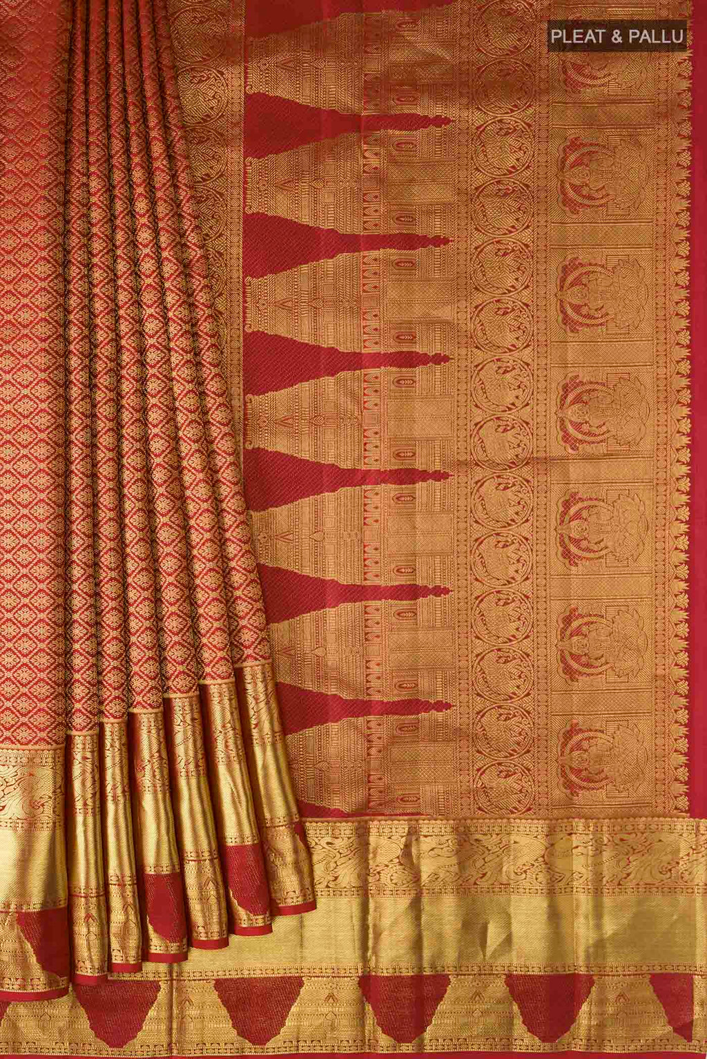 Pleats and pallu of Maroon Kanchipuram Silk Saree with Zari Butta on the body and Zari Border