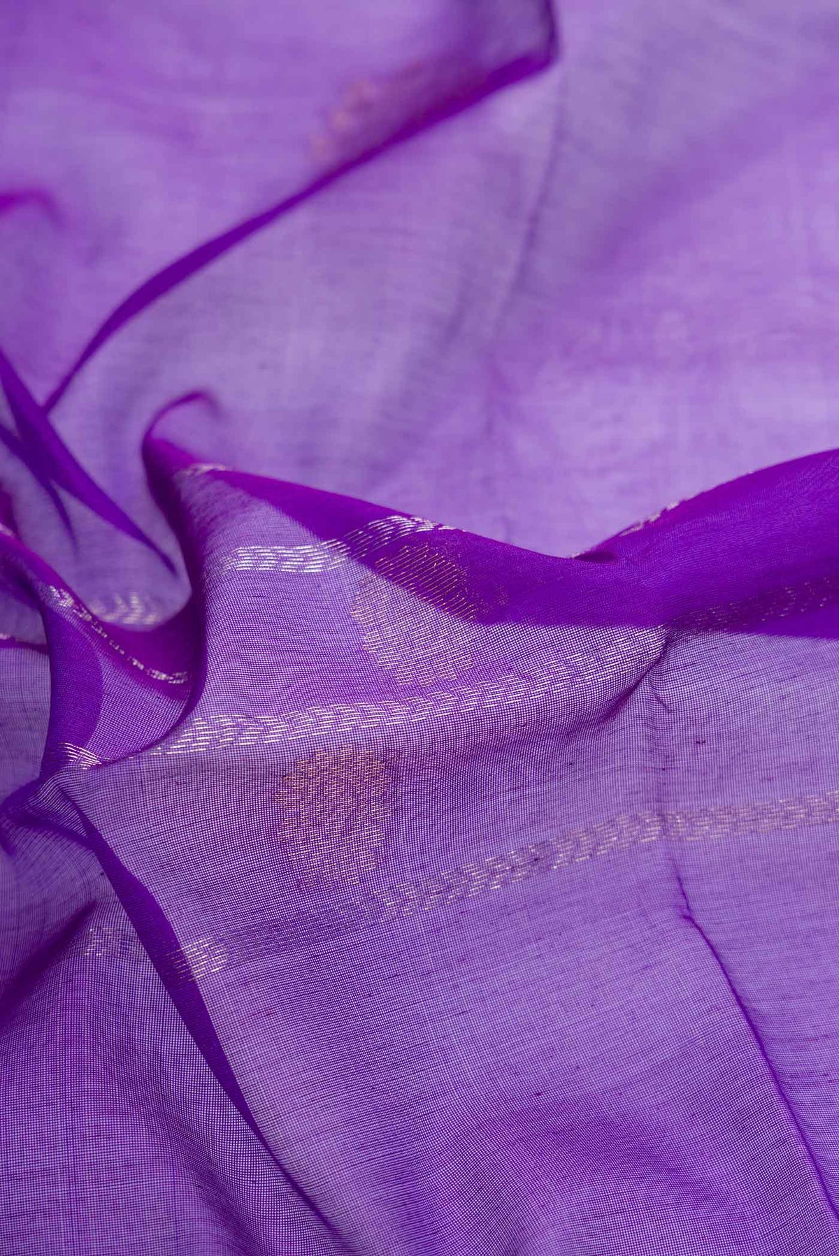 Close up of Violet Dual Tone Silk Cotton Saree with Zari Butta on the body and Zari Border displaying folds