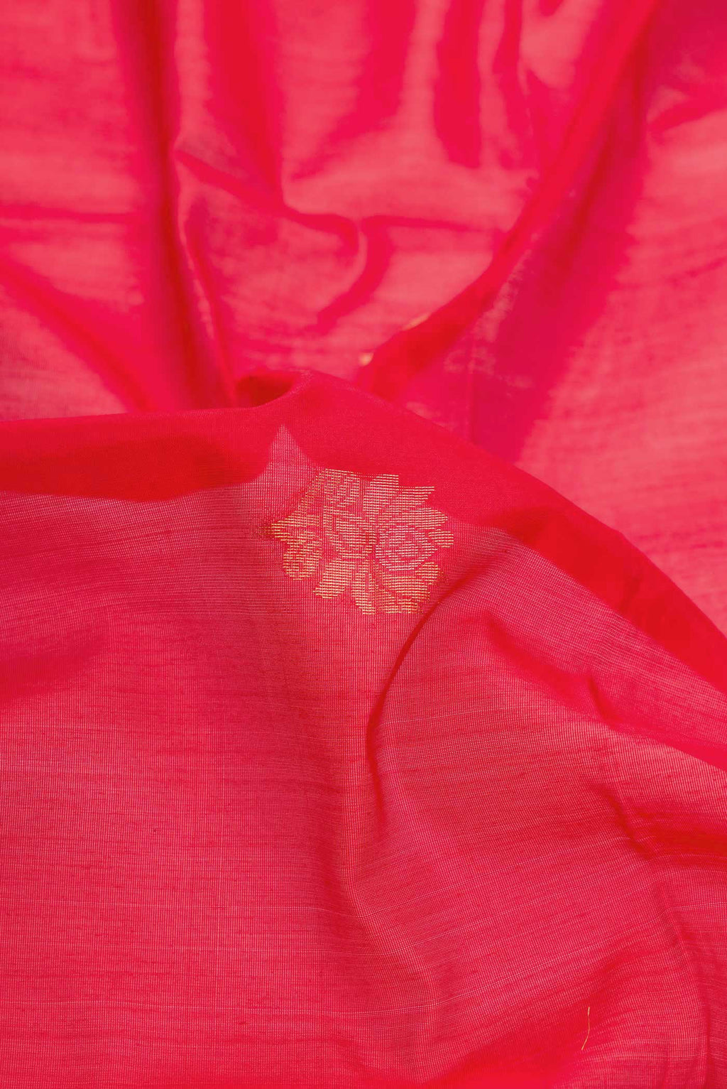 Close up of Red Dual Tone Silk Cotton Saree with Zari Butta on the body and Zari Border displaying folds