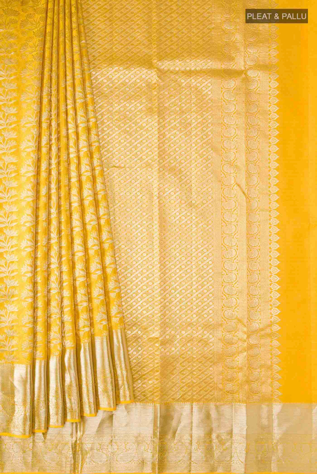 Pleats and pallu of Yellow Kanchipuram Silk Saree with Zari Brocade on the body and Zari Border