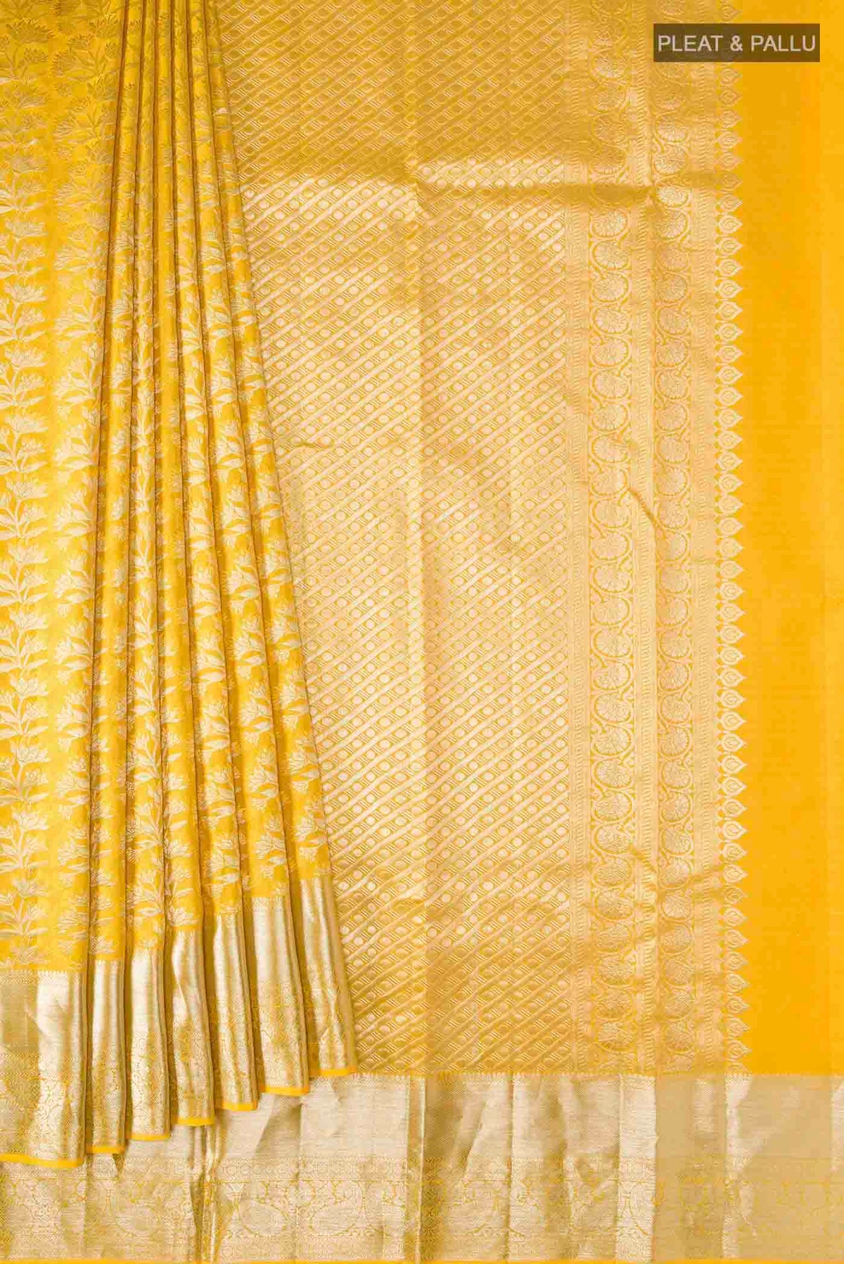Pleats and pallu of Yellow Kanchipuram Silk Saree with Zari Brocade on the body and Zari Border