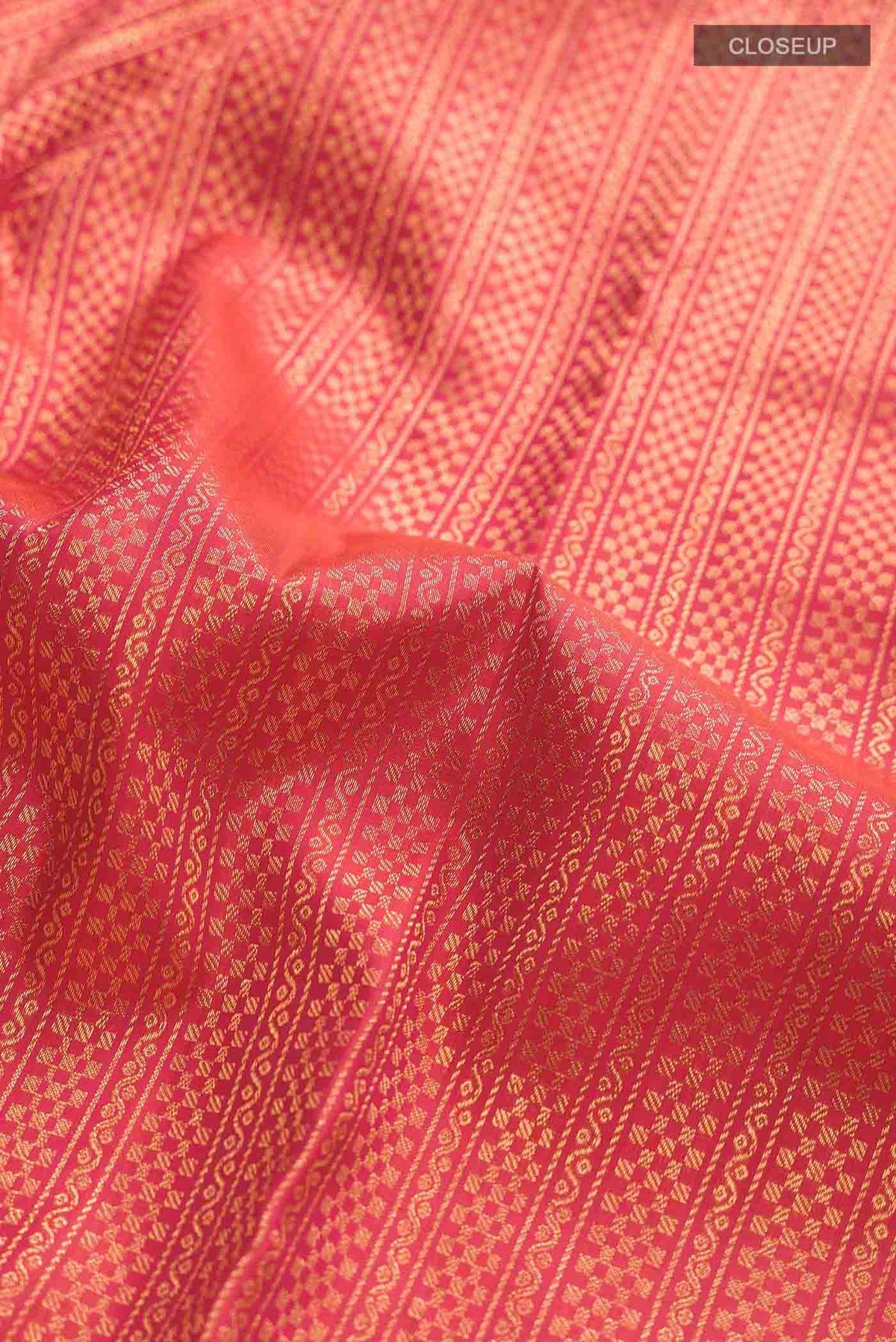 Close up of Multi Color Kanchipuram Silk Saree with Stripes on the body and Zari Border displaying folds