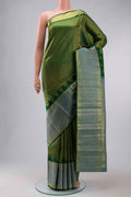 Green Kanchipuram Silk Saree with Zari Brocade on the body and Zari Border displayed on a mannequin