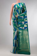 Green and Peacock Blue Color Kanchipuram Silk Saree with Zari Brocade on the body and Without Border.  displayed on a mannequin