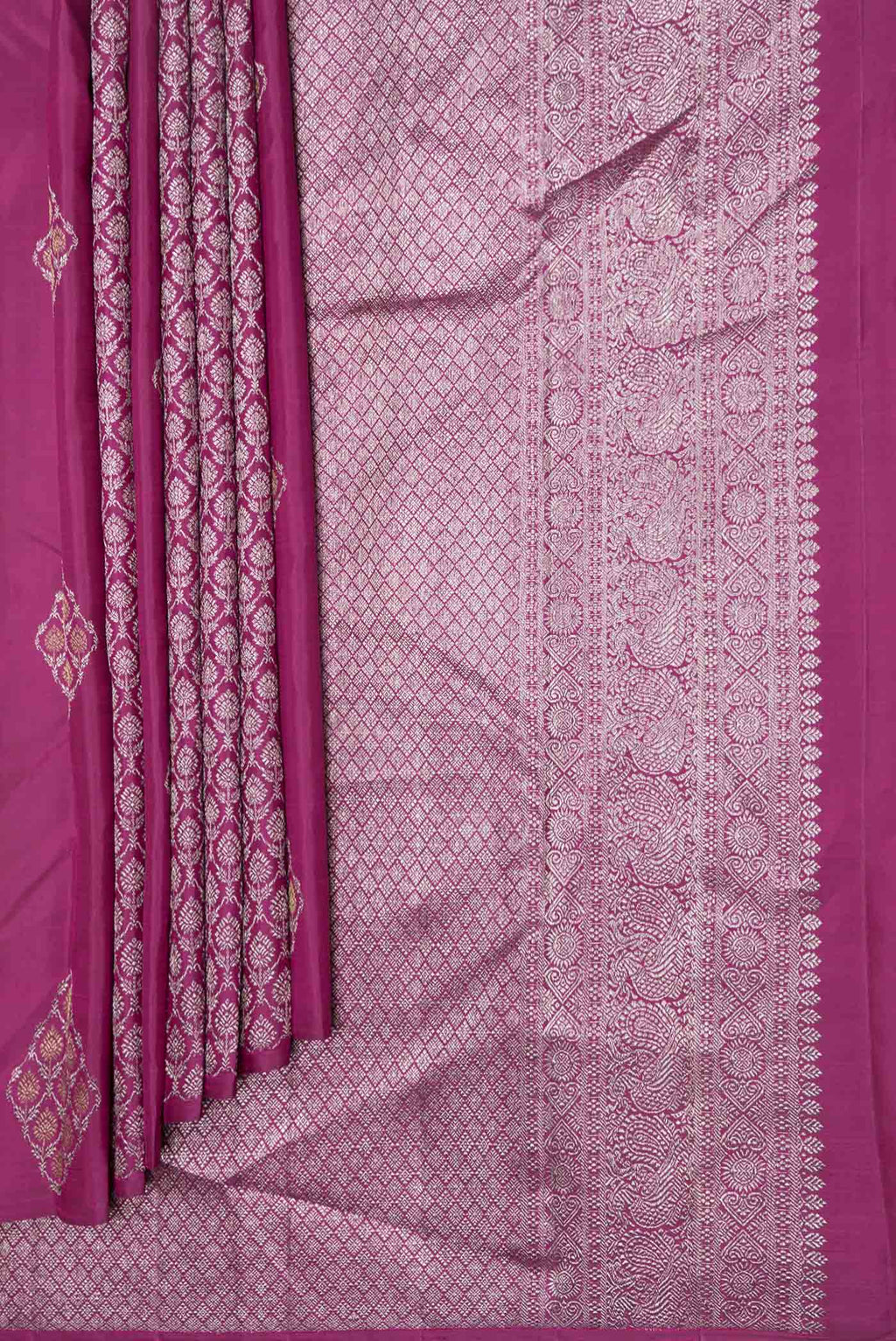 Pleats and pallu of Magenta Dual Tone Kanchipuram Saree with Zari Butta on the body and Zari Border