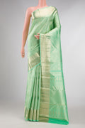 Light Green Dual Tone Kanchipuram Silk Saree with Zari Brocade on the body and Zari Border displayed on a mannequin