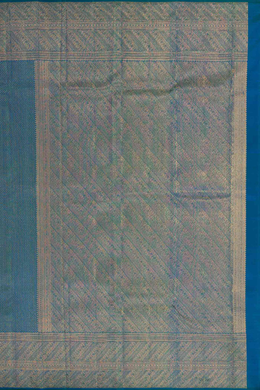 Close up image of the pallu of Peacock Blue Dual Tone Kanchipuram Silk Saree with Zari Brocade on the body and Zari Border. 