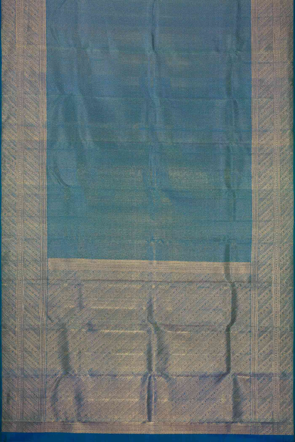 Flat view of Peacock Blue Dual Tone Kanchipuram Silk Saree with Zari Brocade on the body and Zari Border. 