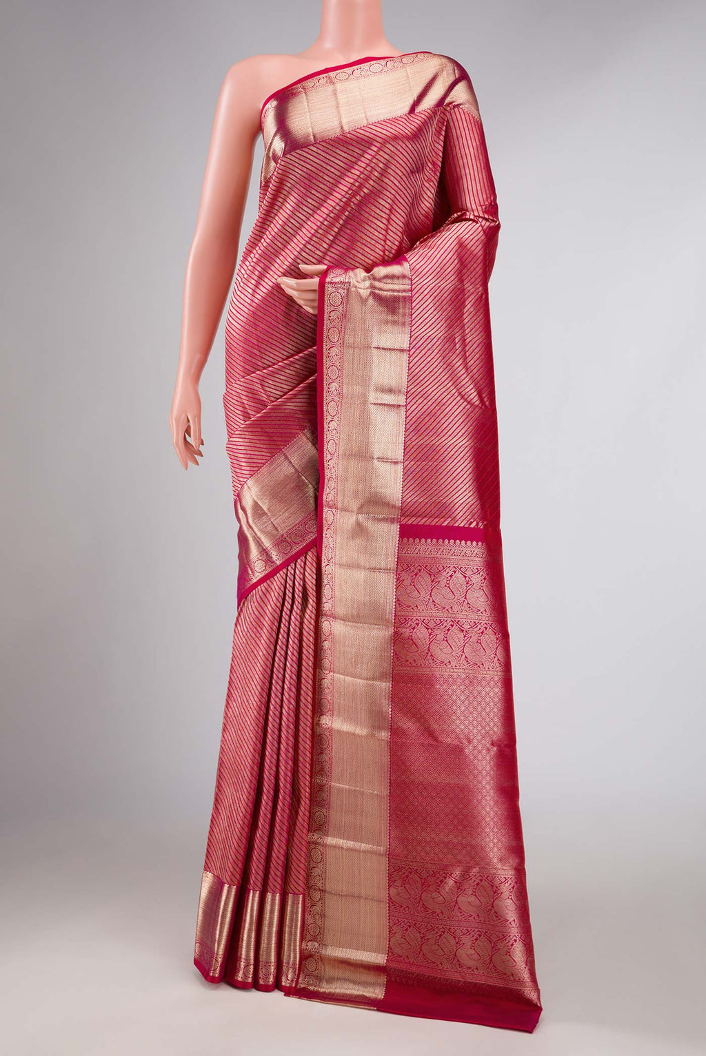 Pink Dual Tone Kanchipuram Silk Saree with Zari Brocade on the body and Zari Border displayed on a mannequin