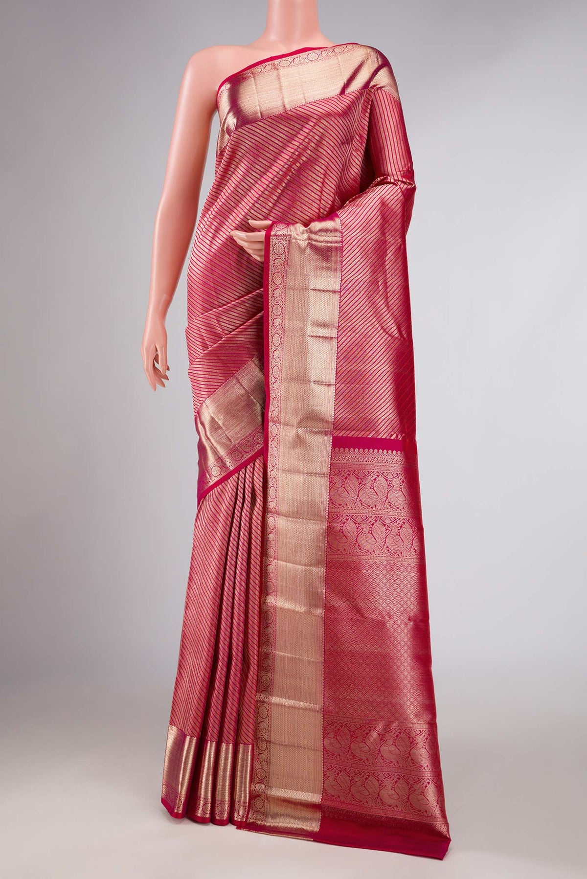 Pink Dual Tone Kanchipuram Silk Saree with Zari Brocade on the body and Zari Border displayed on a mannequin