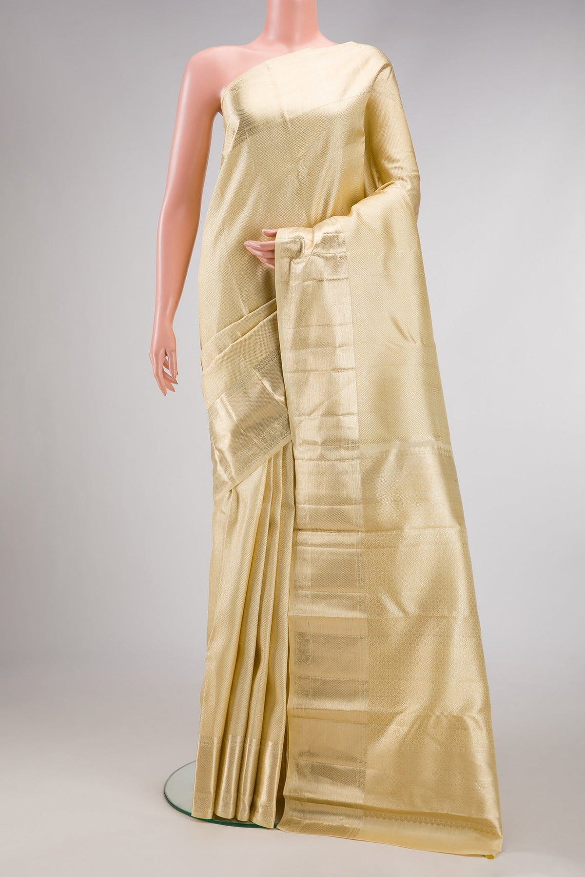 Sandal Dual Tone Kanchipuram Silk Saree with Zari Brocade on the body and Zari Border.  displayed on a mannequin