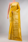 Yellow Dual Tone Kanchipuram Silk Saree with Zari Brocade on the body and Zari Border displayed on a mannequin