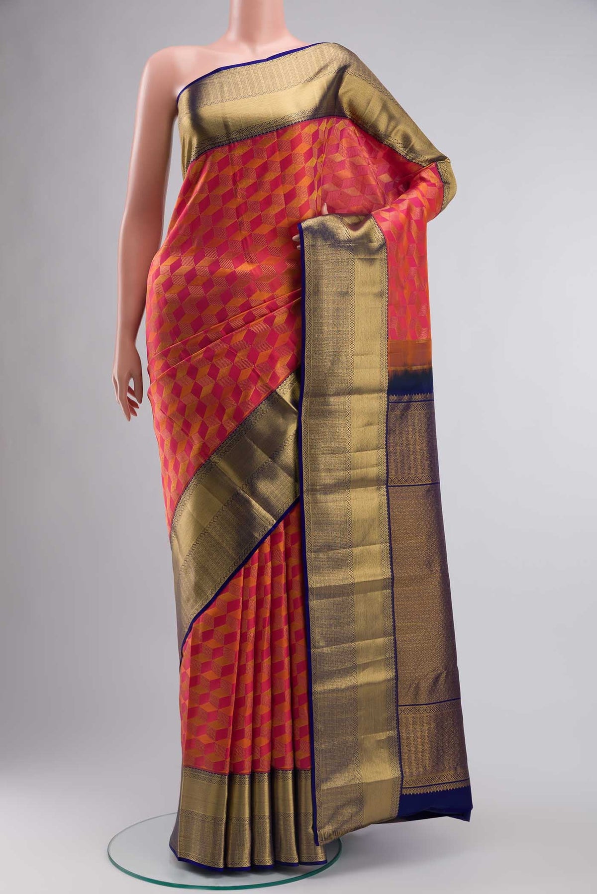Pink with Orange Dual Tone Kanchipuram Silk Saree with Zari Brocade on the body and Zari Border displayed on a mannequin
