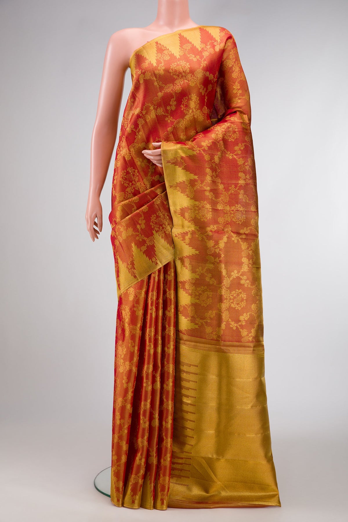 Dark Pink Dual Tone Kanchipuram Tissue Silk Saree with Zari Brocade on the body and Temple Border.  displayed on a mannequin