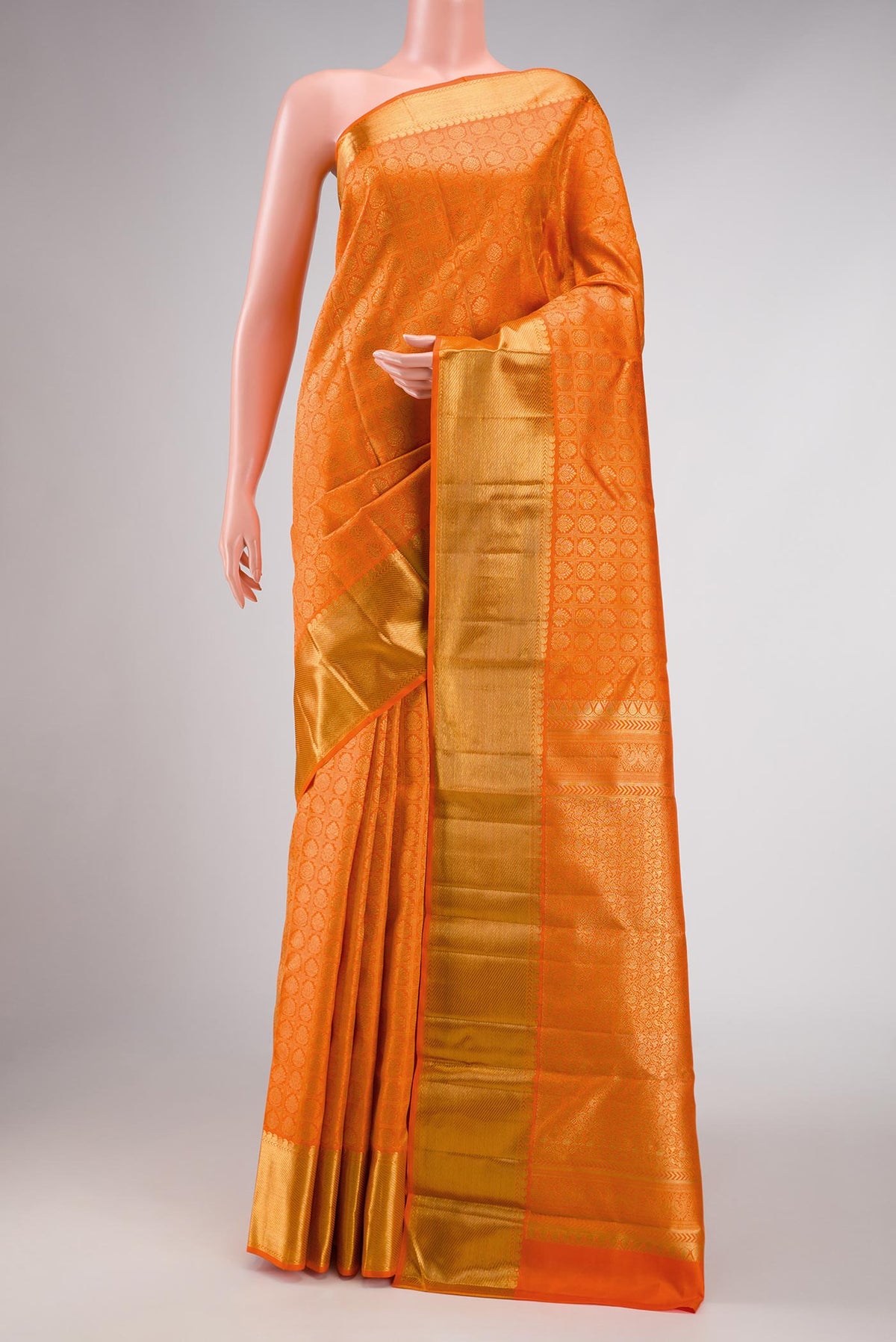 Pure Silk Pure Zari Orange Dual Tone Kanchipuram Saree with Zari Brocade on the body and Zari Border displayed on a mannequin