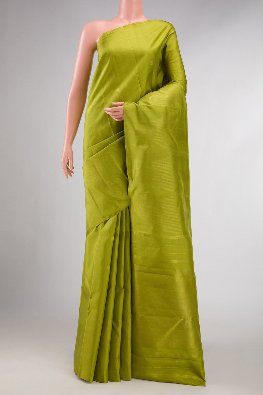 Pure Silk Pure Zari Parrot Green Dual Tone Kanchipuram Saree with Zari Butta on the body and Plain Border displayed on a mannequin