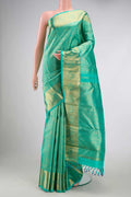 Pure Silk Pure Zari Sea Green Dual Tone Kanchipuram Saree with Zari Brocade on the body and Zari Border displayed on a mannequin