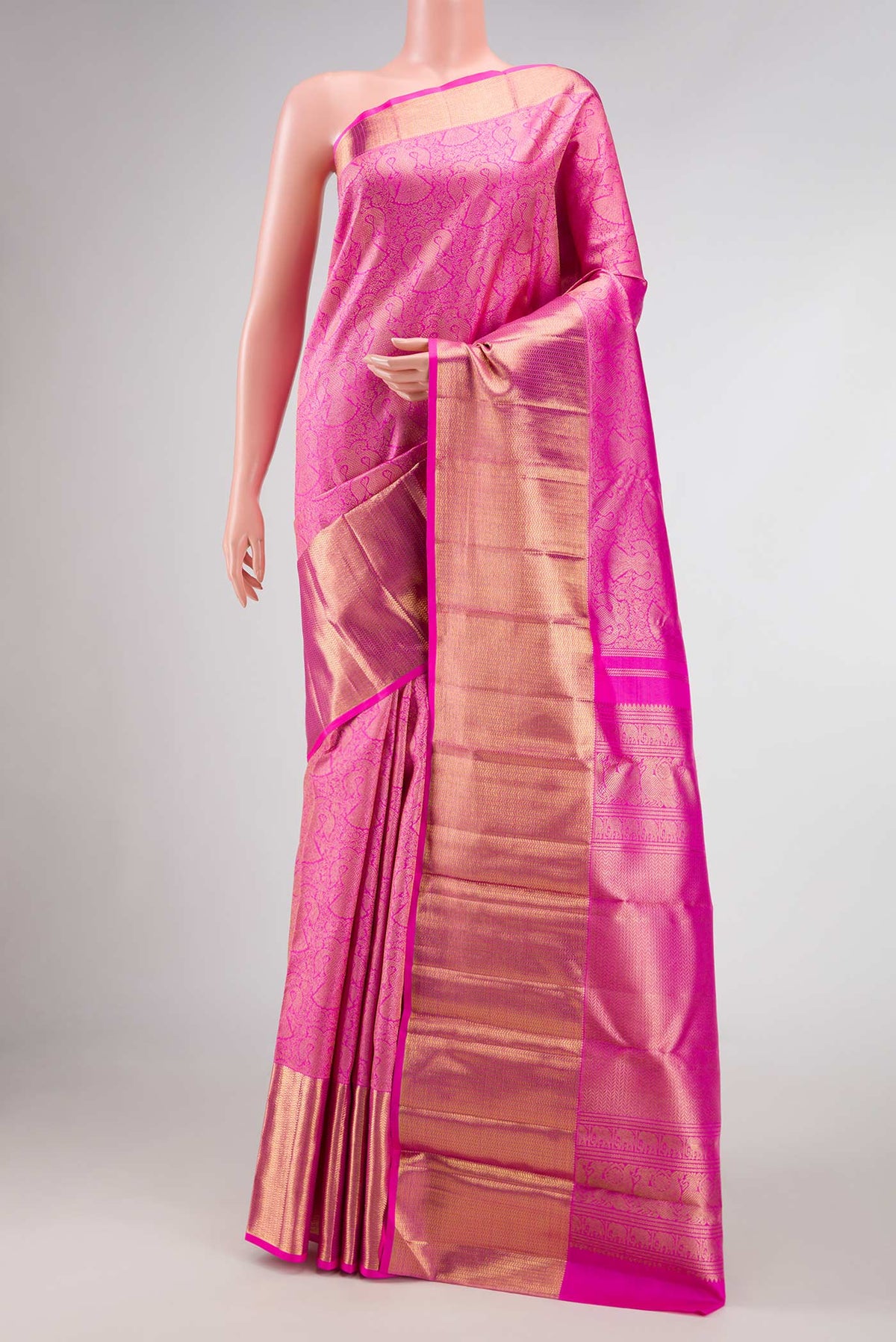 Pure Silk Pure Zari Pink Dual Tone Kanjivaram Saree with Zari Brocade on the body and Zari Border.  displayed on a mannequin